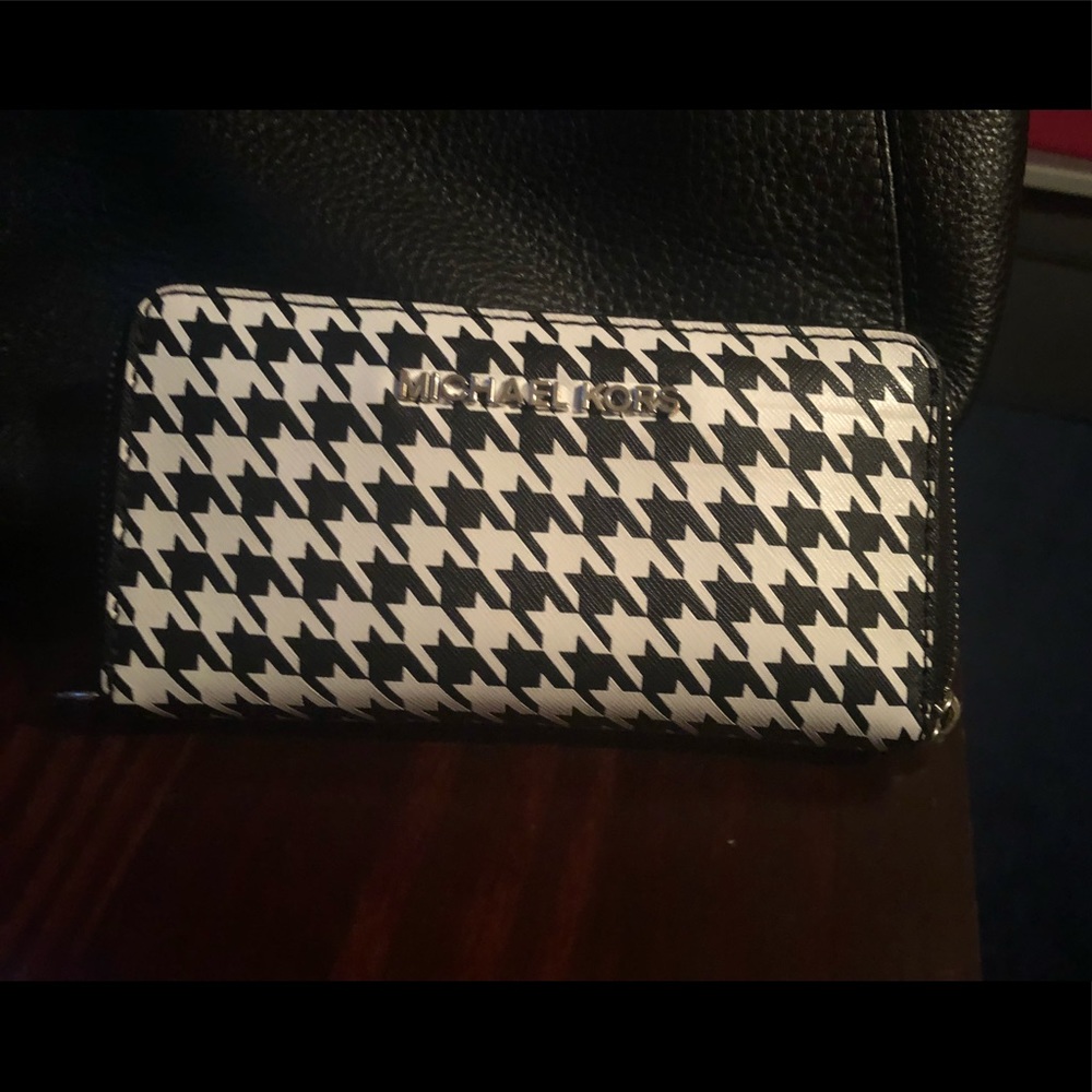 Black Michael Kors purse and black &white wallet.
